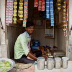 Indian entrepreneur smiling in shop