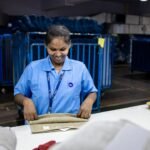 Indian business owner analyzing digital marketing data on laptop